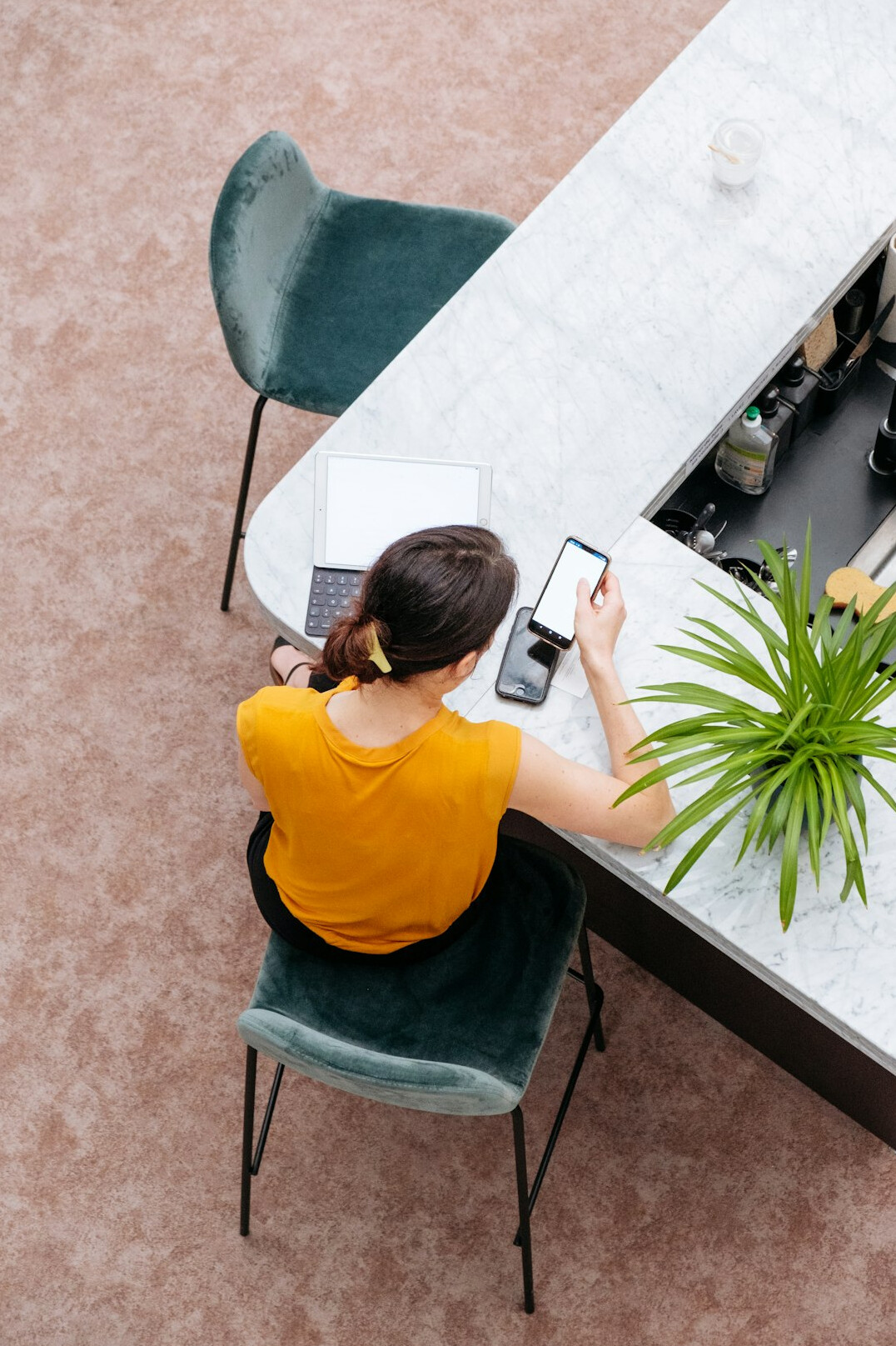 Professional woman working at a laptop in a bright modern office