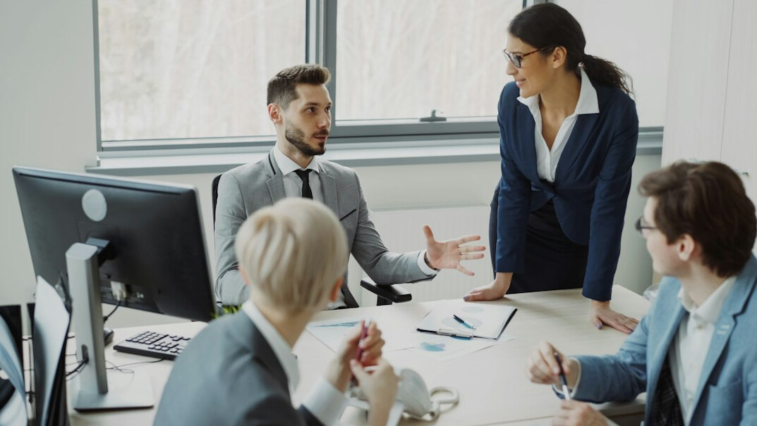 colleagues discussing in office